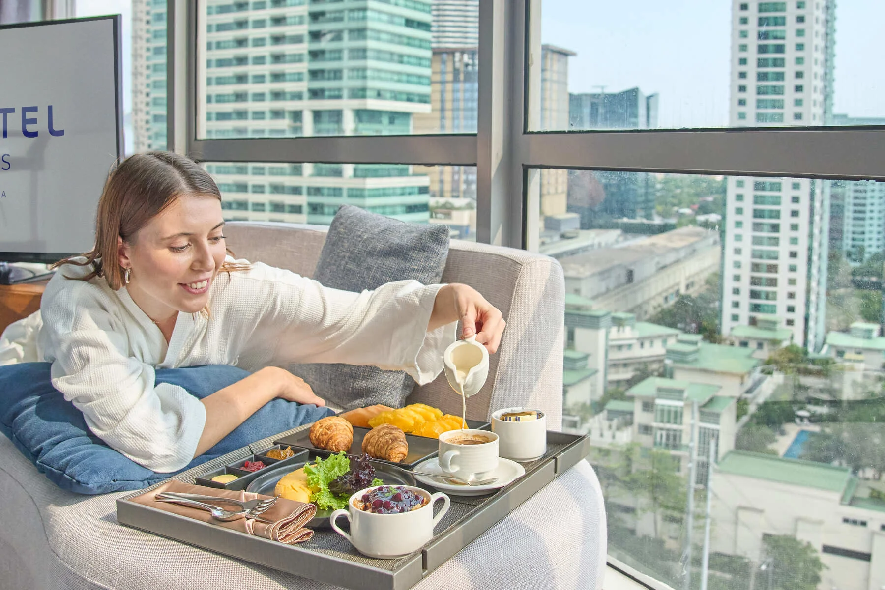 Novotel Suites Manila Lifestyle premier suite with  lady model shot by Artem levy Photography at Vipixel Produsctions