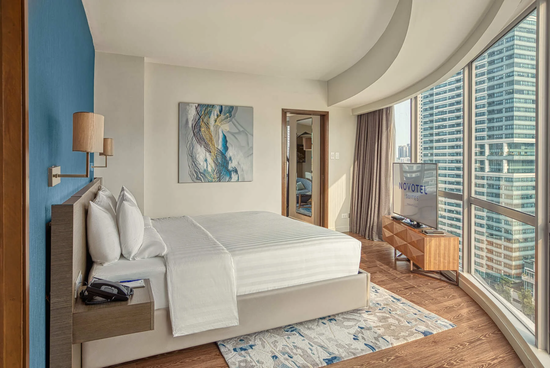 Novotel Suites Manila premier suite bedroom By Artem Levy at Vipixel Productions
