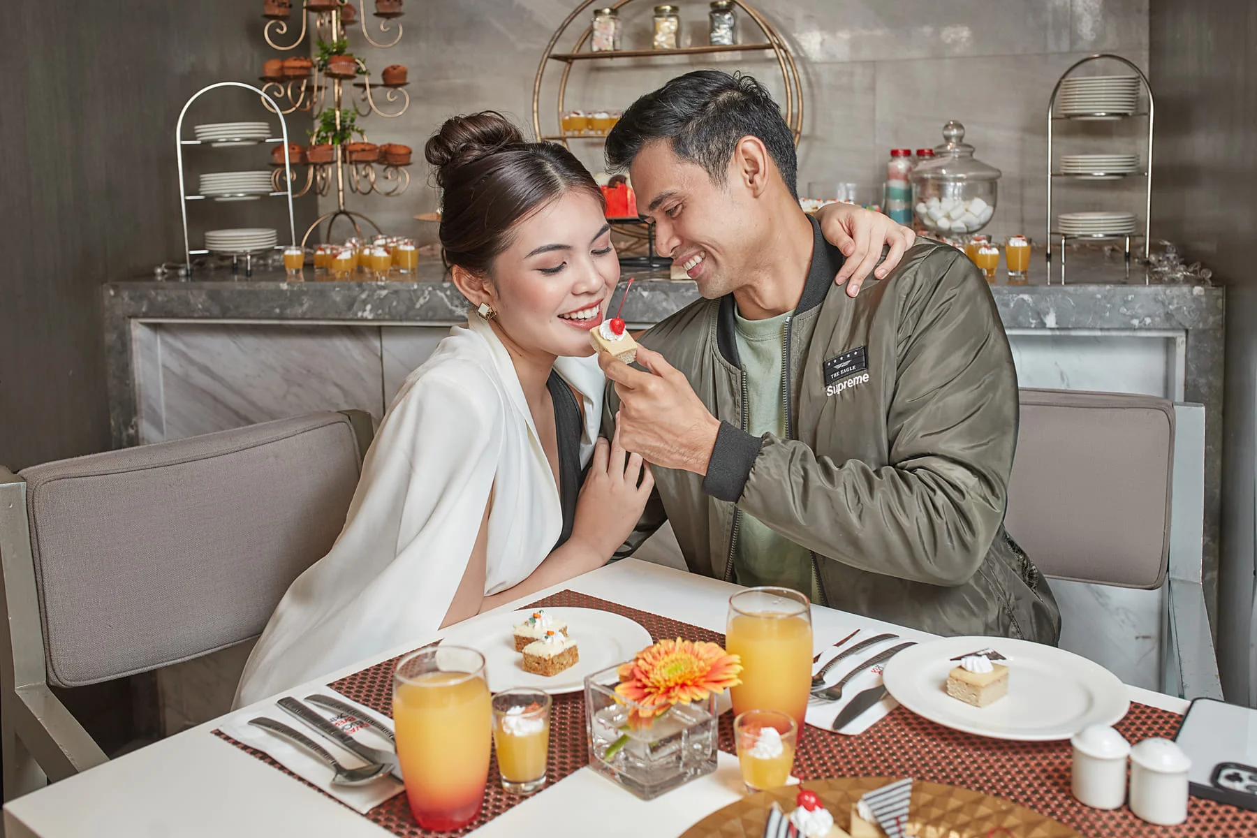 couple eating on savoy hotel manila restaurant photo by Artem levy