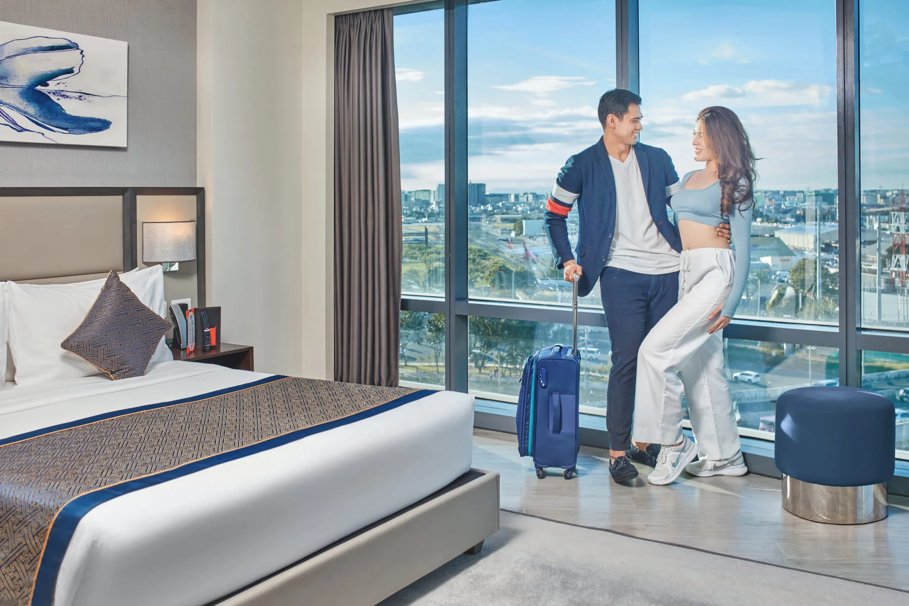 Couple in Deck Suite standing near the windows photo by Artem Levy