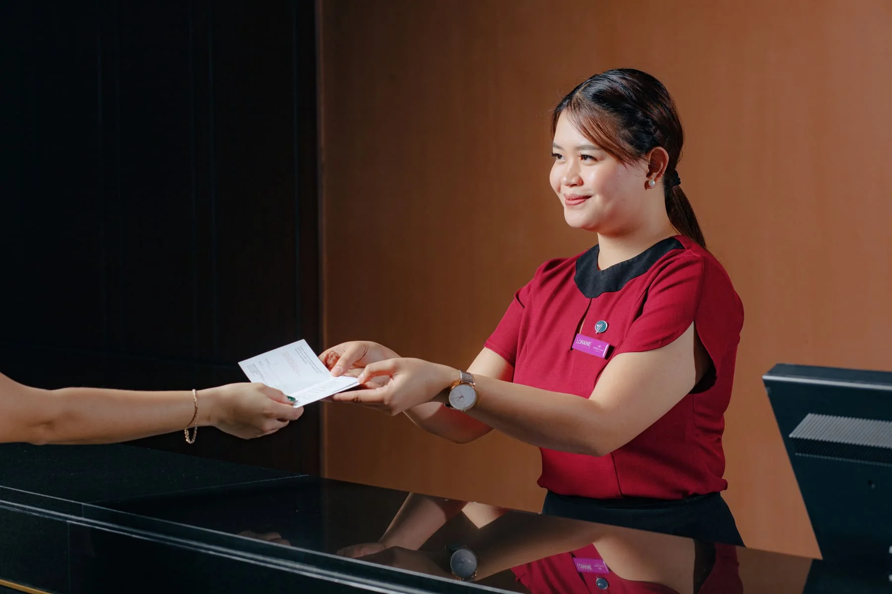 IMG_2561 Receptionist at Crowne Plaza Manila photo by Artem Levy at Vipixel Productions