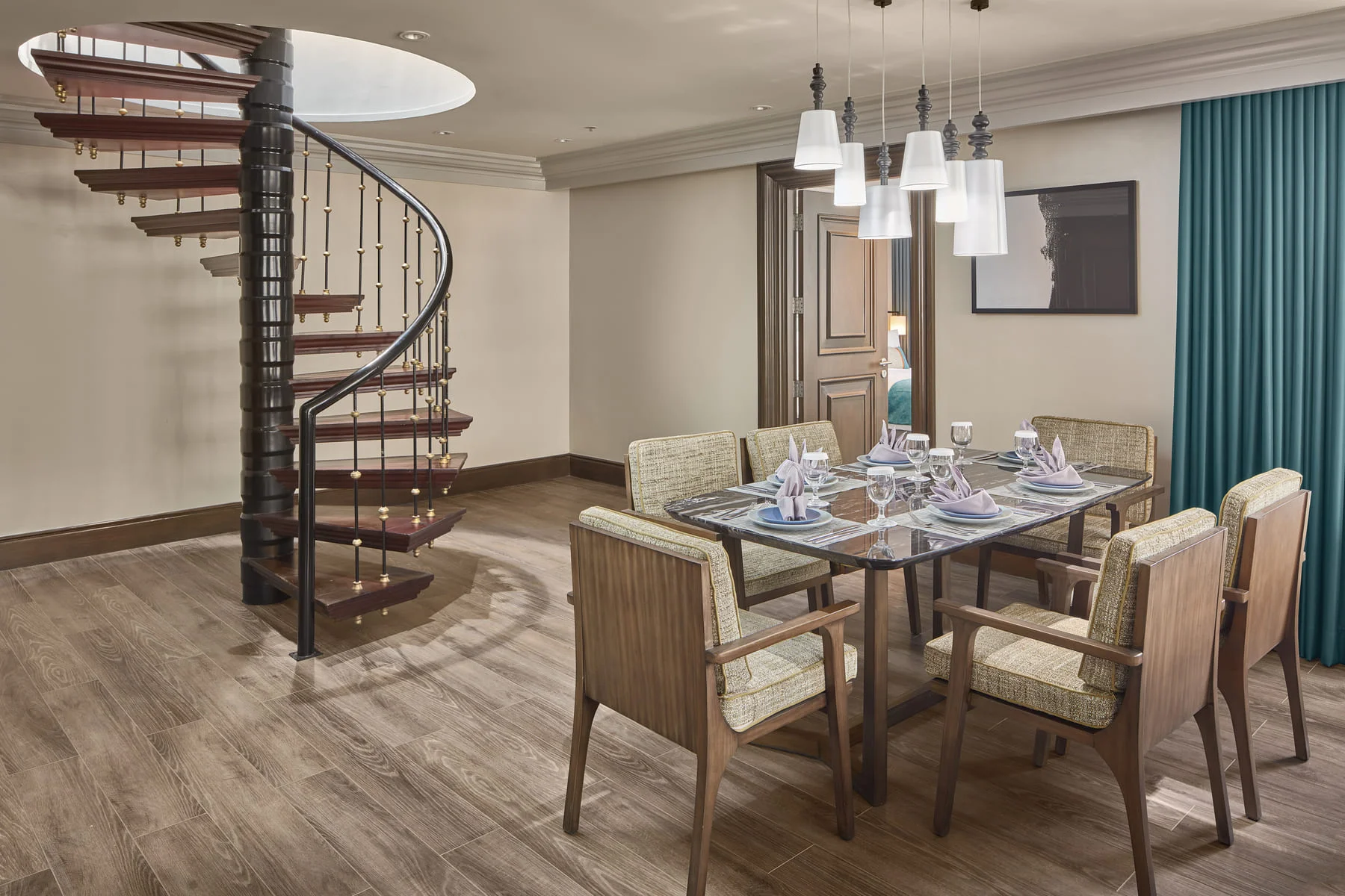 IMG_9746 Penthouse suite dining and round staircase photo by Artem Levy of Vipixel Productions